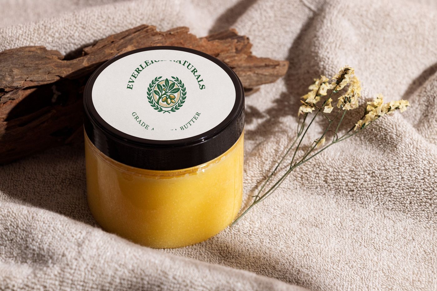 Grade A raw unrefined shea butter — golden, in an open jar